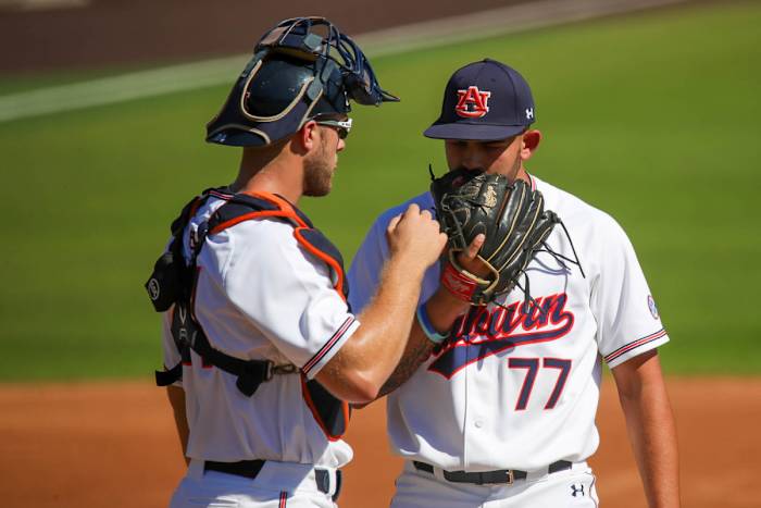 Nate LaRue (left) settles down freshman pitcher Zach Crotchfelt against Louisiana Tech in fall exhibition action